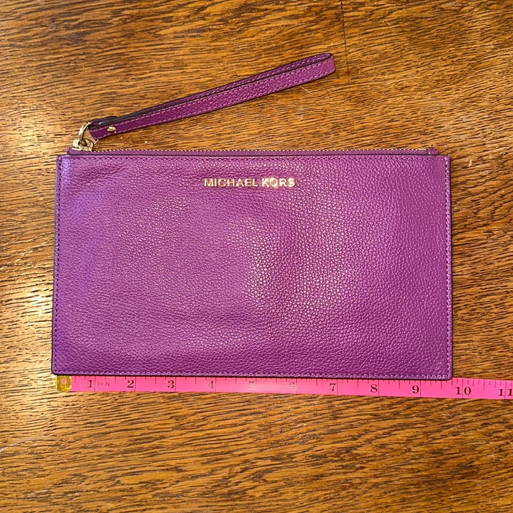Michael Kors purple wristlet with gold zipper/ accents
